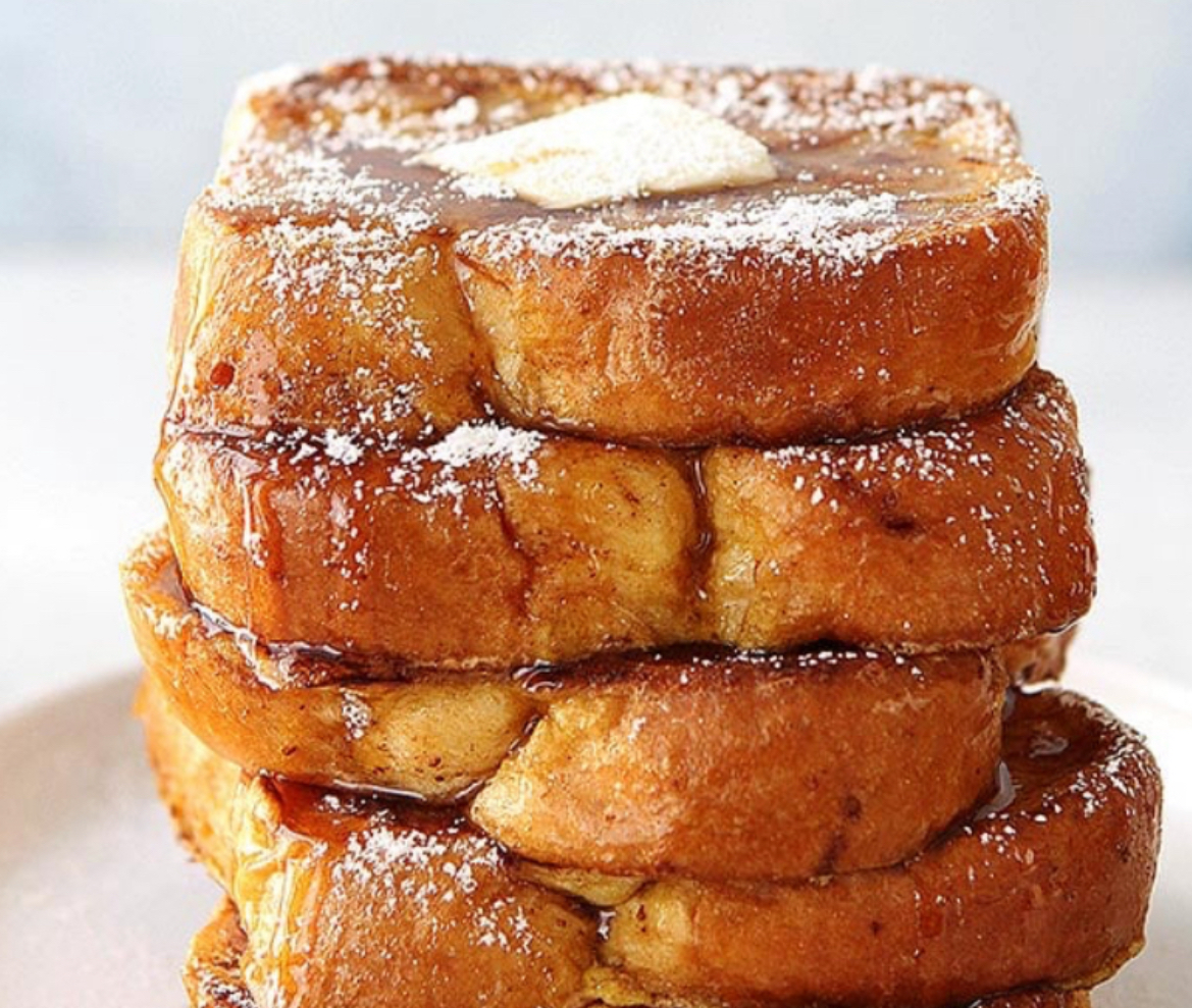 Close-up of a powdered breakfast dish with butter